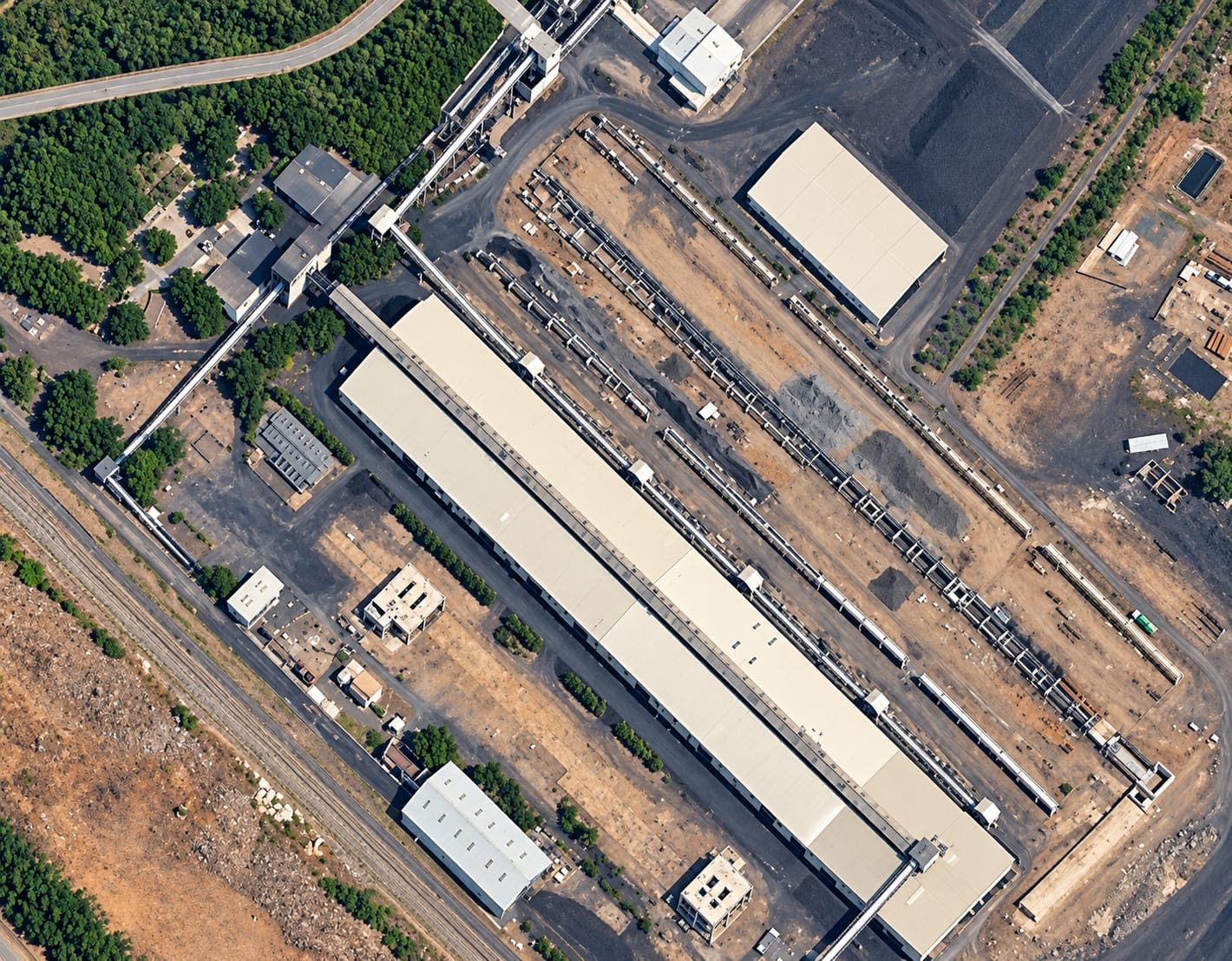 Aerial view of a coal handling plant with covered conveyor galleries